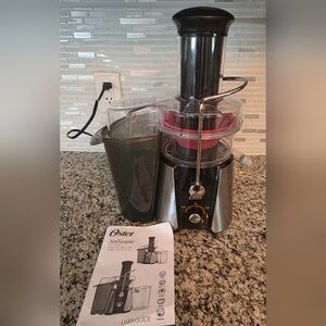 Oster Stainless Steel and Black Centrifugal Juice Extractor. No Pitcher